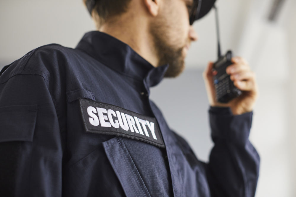 Professional security guard representing payroll funding solutions for security companies managing cash flow